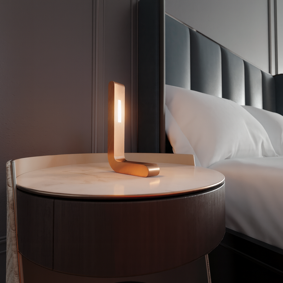 Handcrafted copper finish L-shaped wooden LED lamp by WOOM on a round marble nightstand.