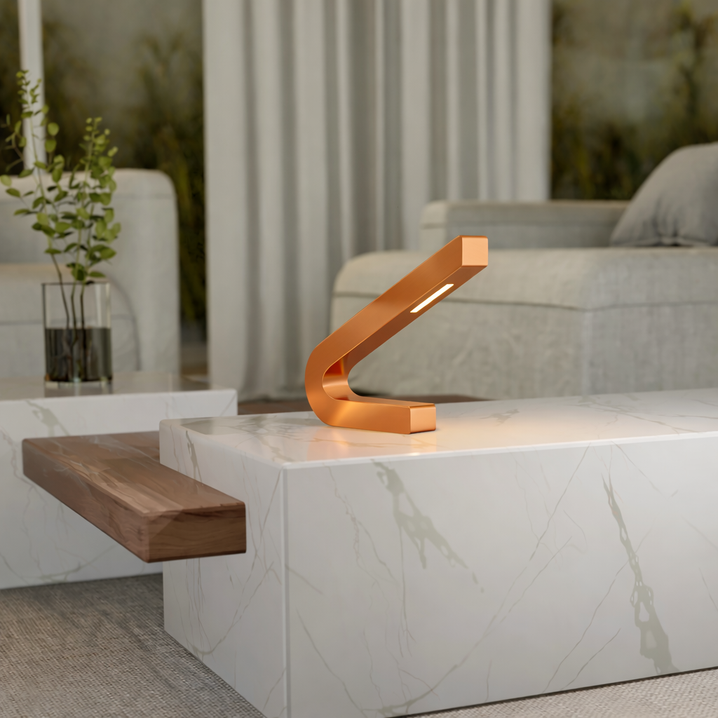 Curved copper finish LED lamp by WOOM, resting on a white marble table in a modern living room.