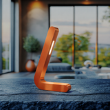 Copper finish L-shaped wooden lamp by WOOM, with a vertical light strip, on a dark textured tabletop.