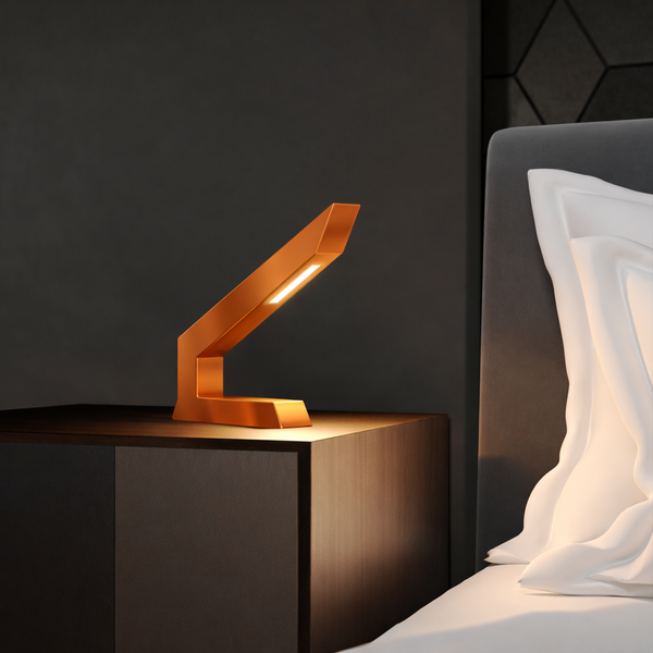 Copper finish oak angular table lamp by WOOM, with a bright LED on a dark nightstand.