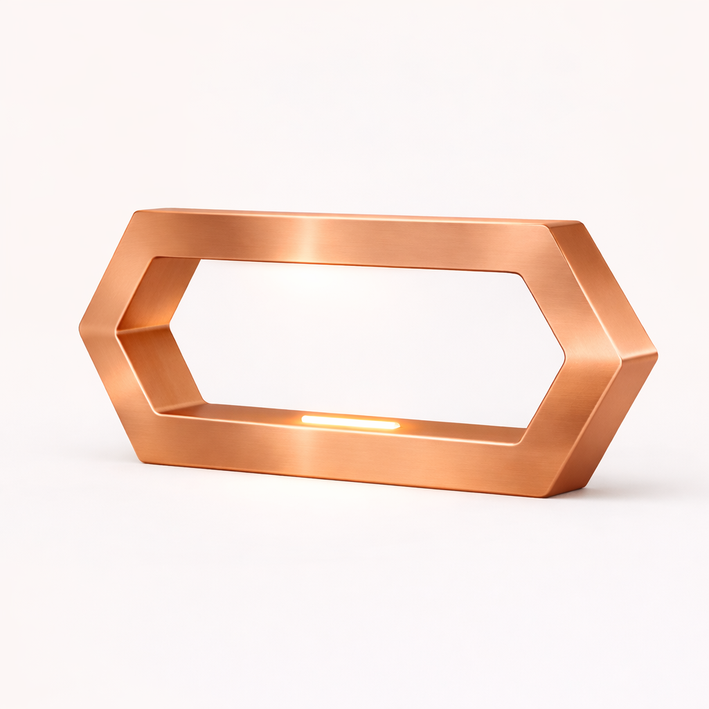 Copper finish hexagon LED table lamp by WOOM, featuring a brushed texture and glowing lights on inner edges.