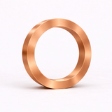 Copper finish circle lamp by WOOM, with a brushed texture and integrated base light.
