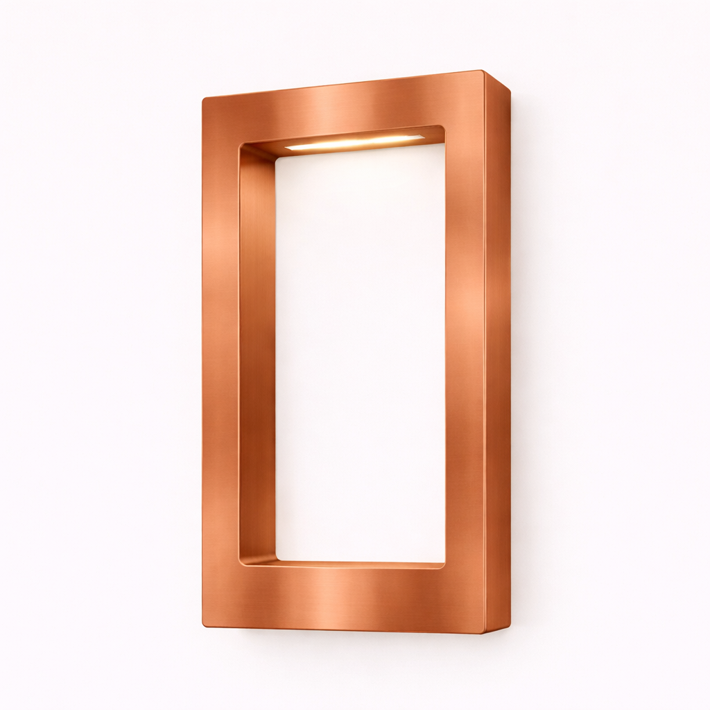 Rectangular wooden lamp with a brushed copper finish by WOOM, mounted on a white wall with a warm light glowing from its top interior.