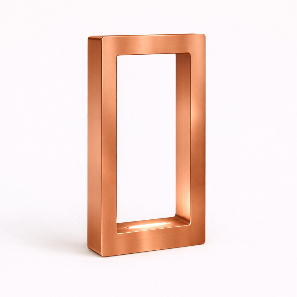 Copper finish rectangular wooden lamp by WOOM, featuring a brushed texture and illuminated inner base.