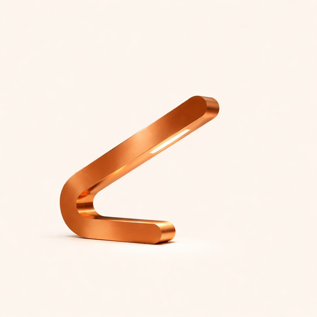 Angled copper finish table lamp by WOOM with a sleek, curved design and an illuminated strip light.