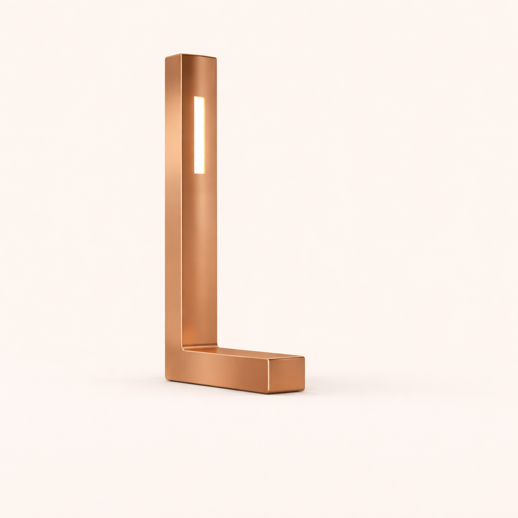 Copper finish L-shaped table lamp by WOOM, featuring a vertical illuminated strip.