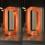 Copper finish rounded rectangular table lamp by WOOM, with soft internal light and a brushed texture.