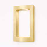 Gold finish rectangular lamp by WOOM, featuring a wall-mounted open frame design with internal top lighting.