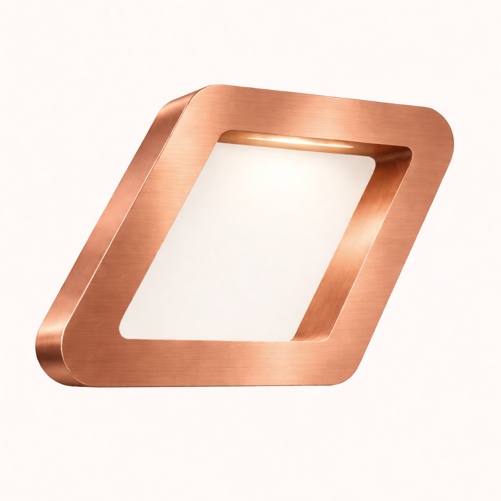 Copper finish square lamp by WOOM with brushed texture, framing a glowing white interior.